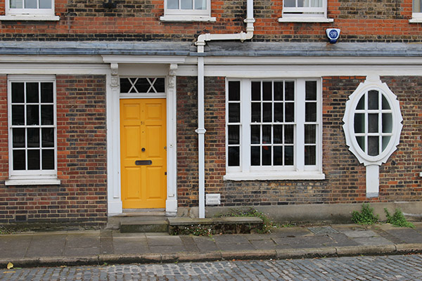 yellow door and oval window